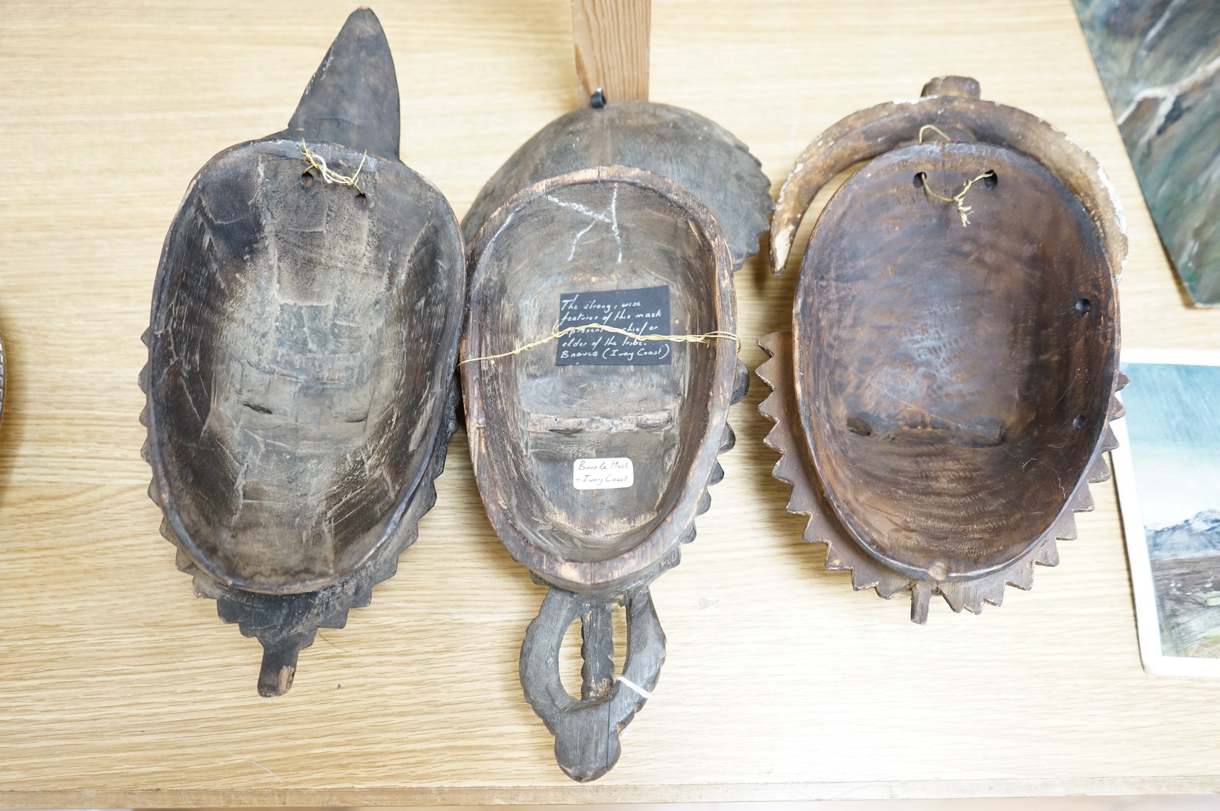 Three African carved hardwood masks, largest 39cm high. Condition - fair